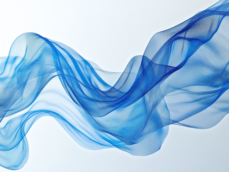 An image of translucent blue fabric-like form against a clean white background.